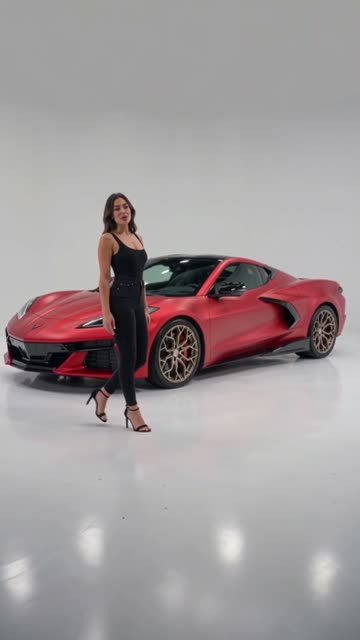 Red Chevrolet Corvette in a virtual studio with an AI presenter